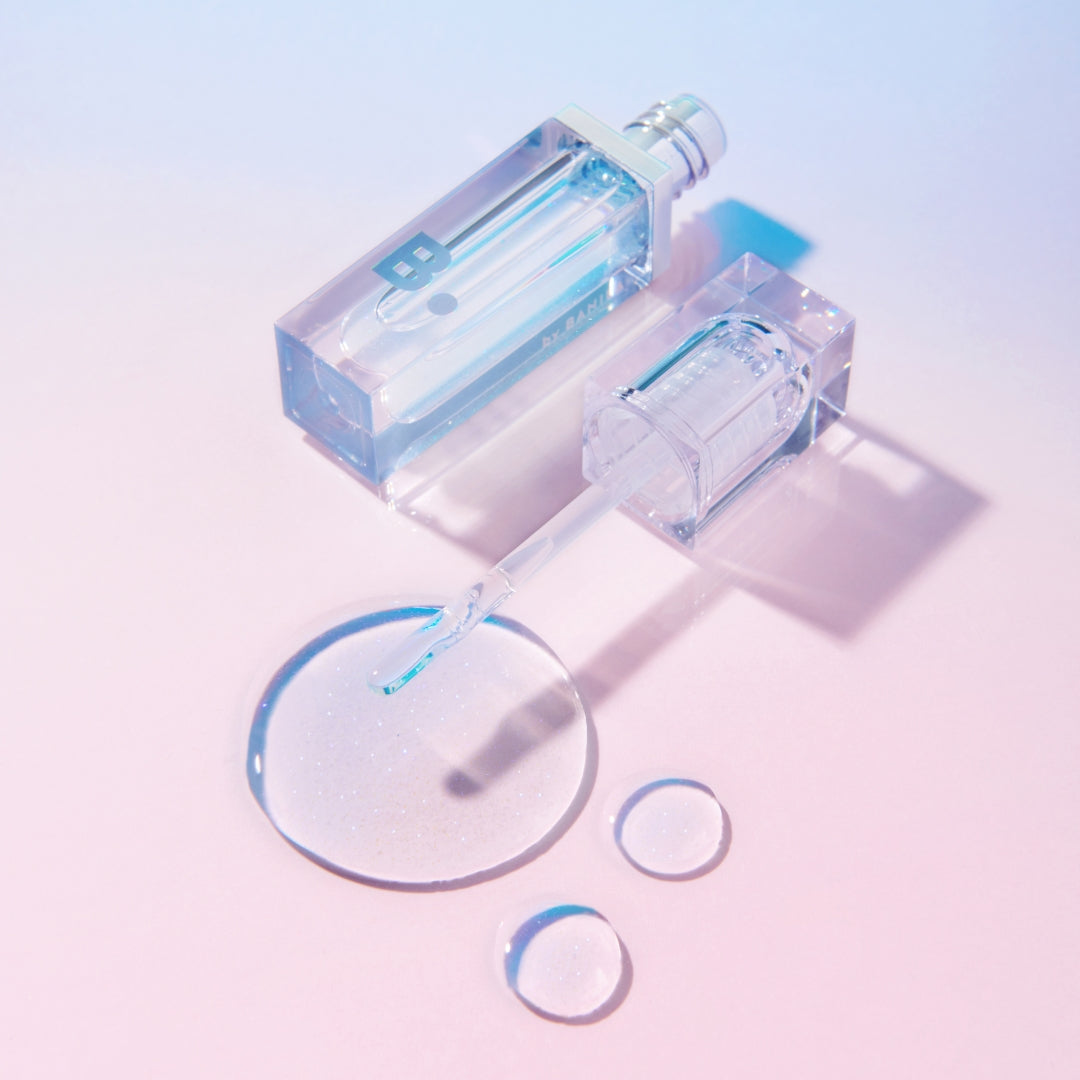 Banila Co B. By Banila Volume Lip Plumper Maxi showing a clear lip gloss tube with a tapered applicator for fuller lips