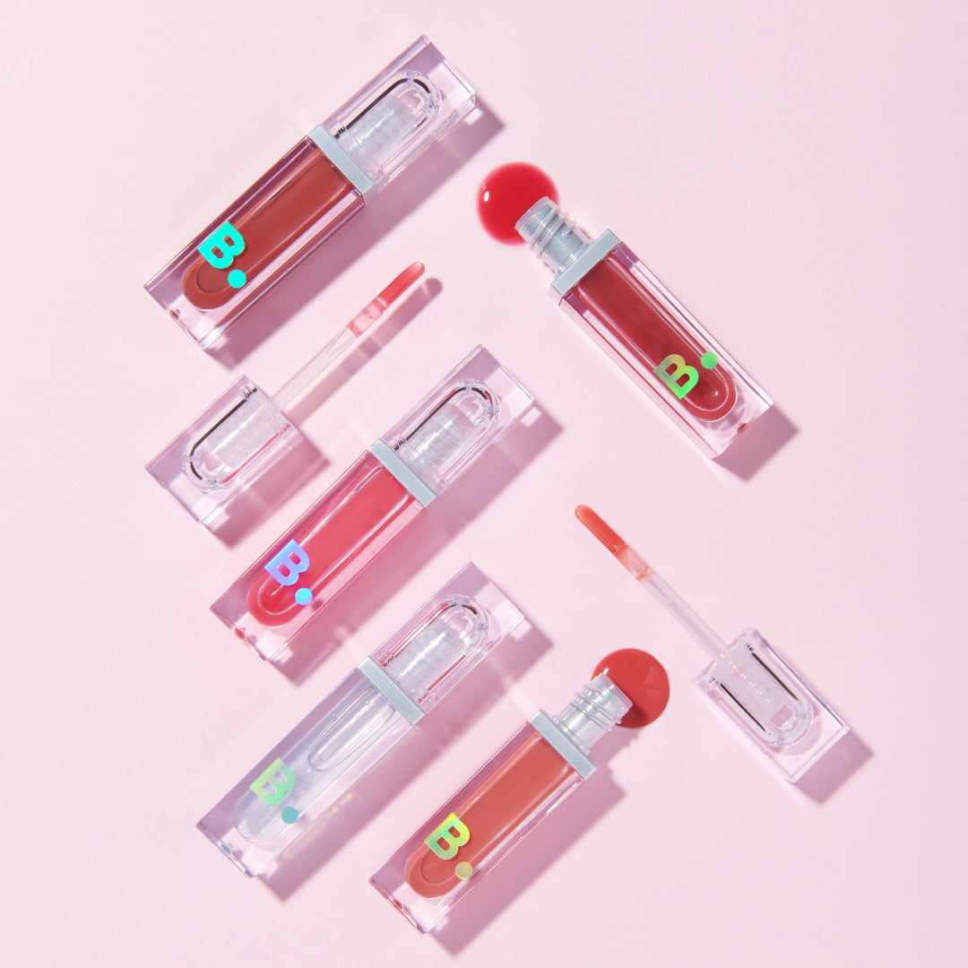 Banila Co B. By Banila Volume Lip Plumper Maxi tube with clear gloss and silver cap, showcasing a sleek, compact lip enhancement product