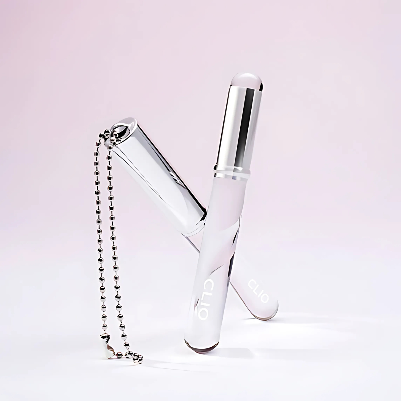 Clio Baby Taptap Lip Brush with soft bristles and pink handle, designed for precise lipstick application.