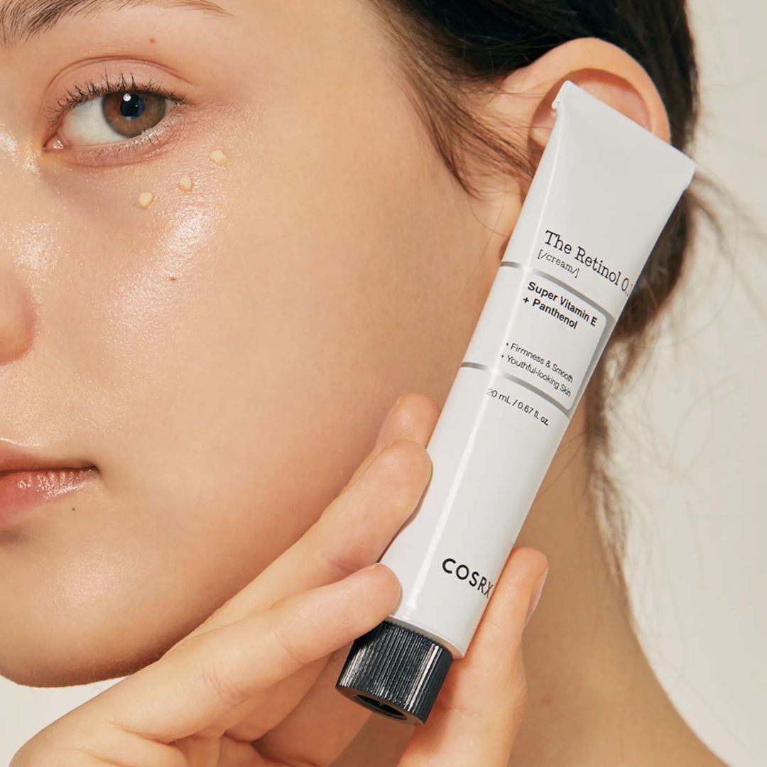 Cream jar labeled "The Retinol 0.1" face moisturizer by COSRX, with a clean, minimalist design and a white lid.