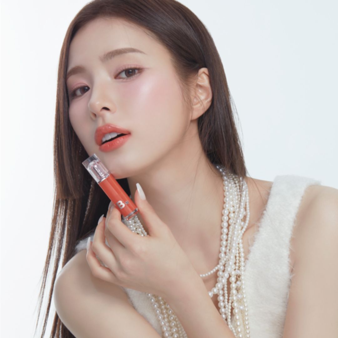 Banila Co Dew Glow Lip Tint in a sleek tube, showcasing the vibrant pink shade and glossy finish of the lip tint product.