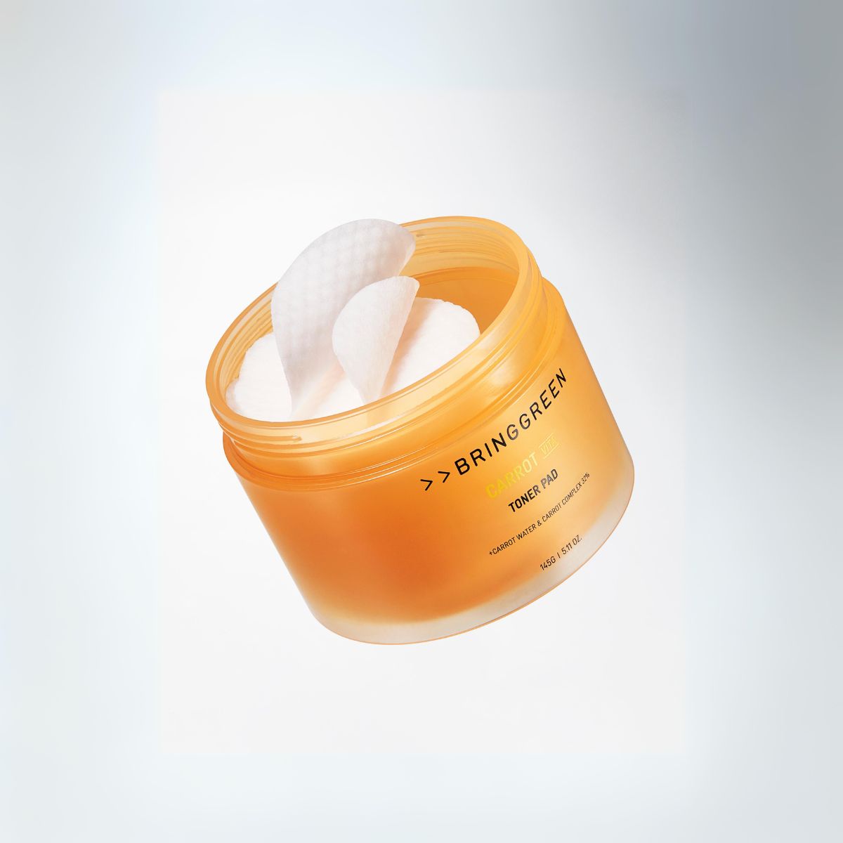 Bring Green Carrot Vita Toner Pad with 60 exfoliating pads, showing textured surface and packaging for radiant skin.