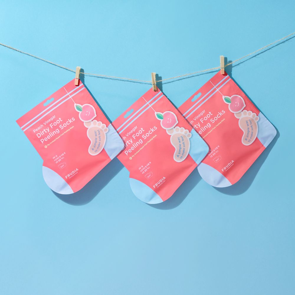 Frudia My Orchard Peach Foot Mask pair showing exfoliating foot mask with peach extract for soft, smooth feet.