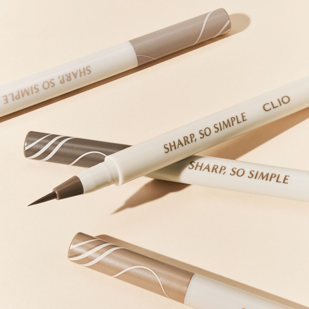 Clio Sharp So Simple Shade Brush Liner liquid eyeliner in three colors, with a sleek brush applicator and precise tip.