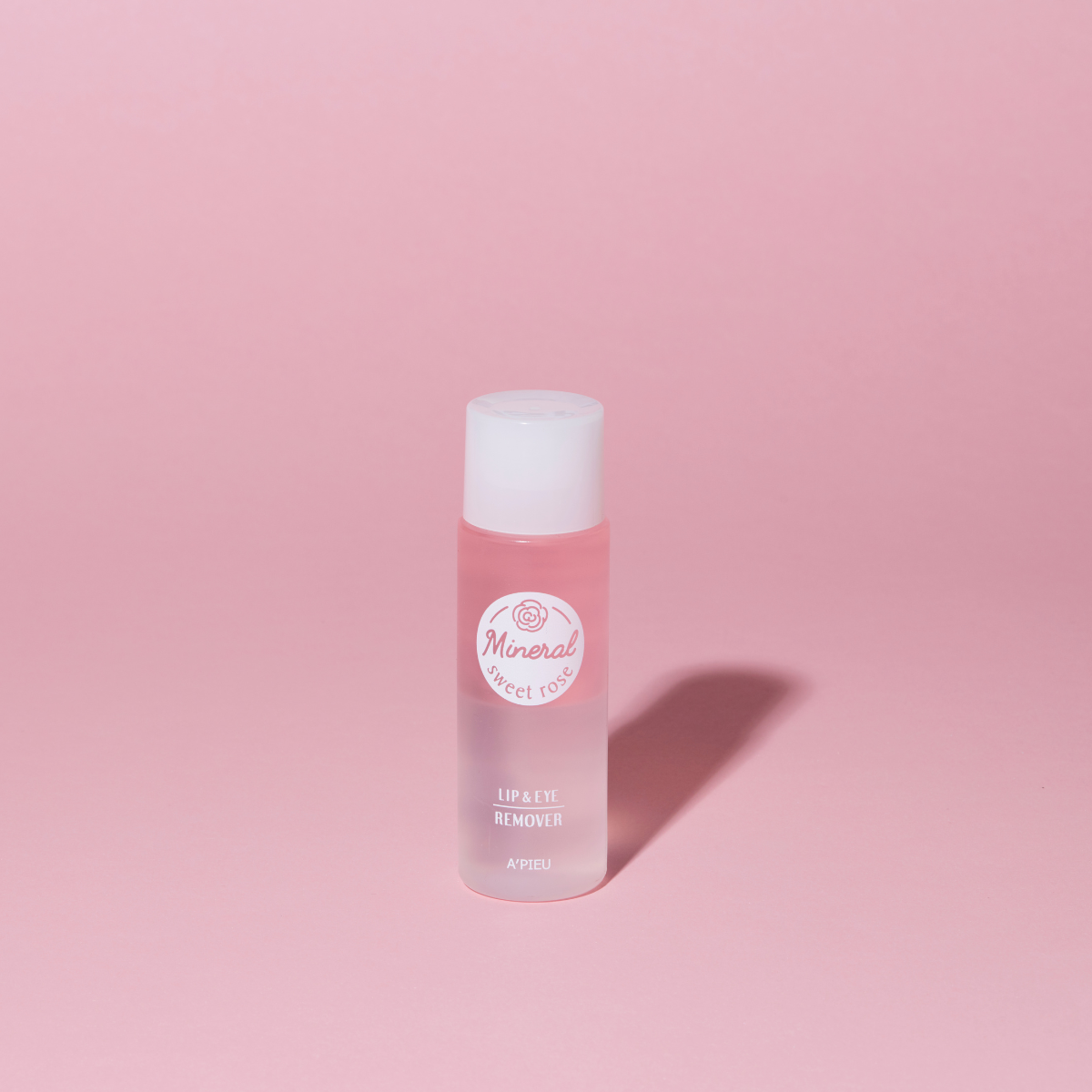 A'pieu Mineral Lip and Eye Makeup Remover bottle with clear liquid inside, designed for gentle removal of lip and eye makeup.