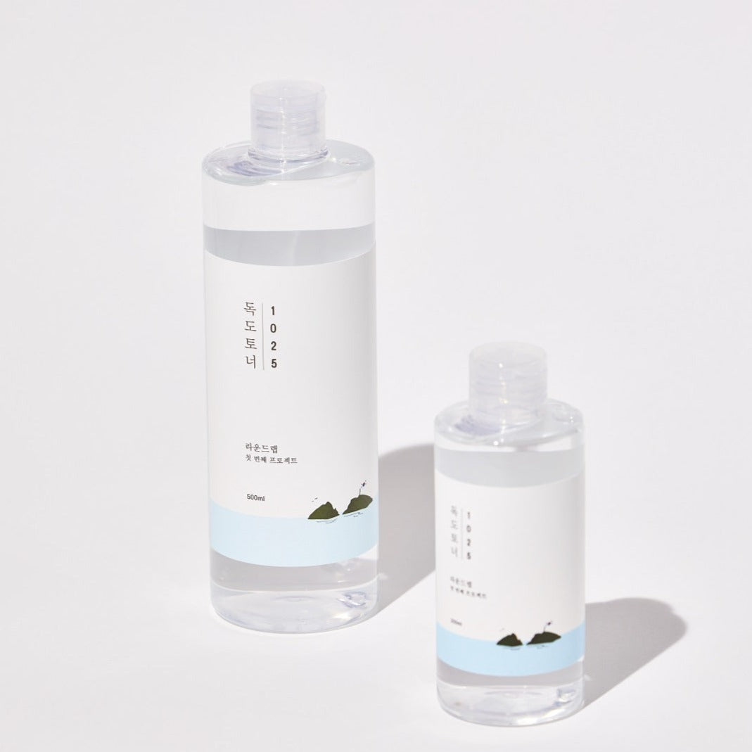 Round Lab Dokdo Toner in 200ml or 500ml bottle, clear liquid skincare product for soothing and hydrating skin.