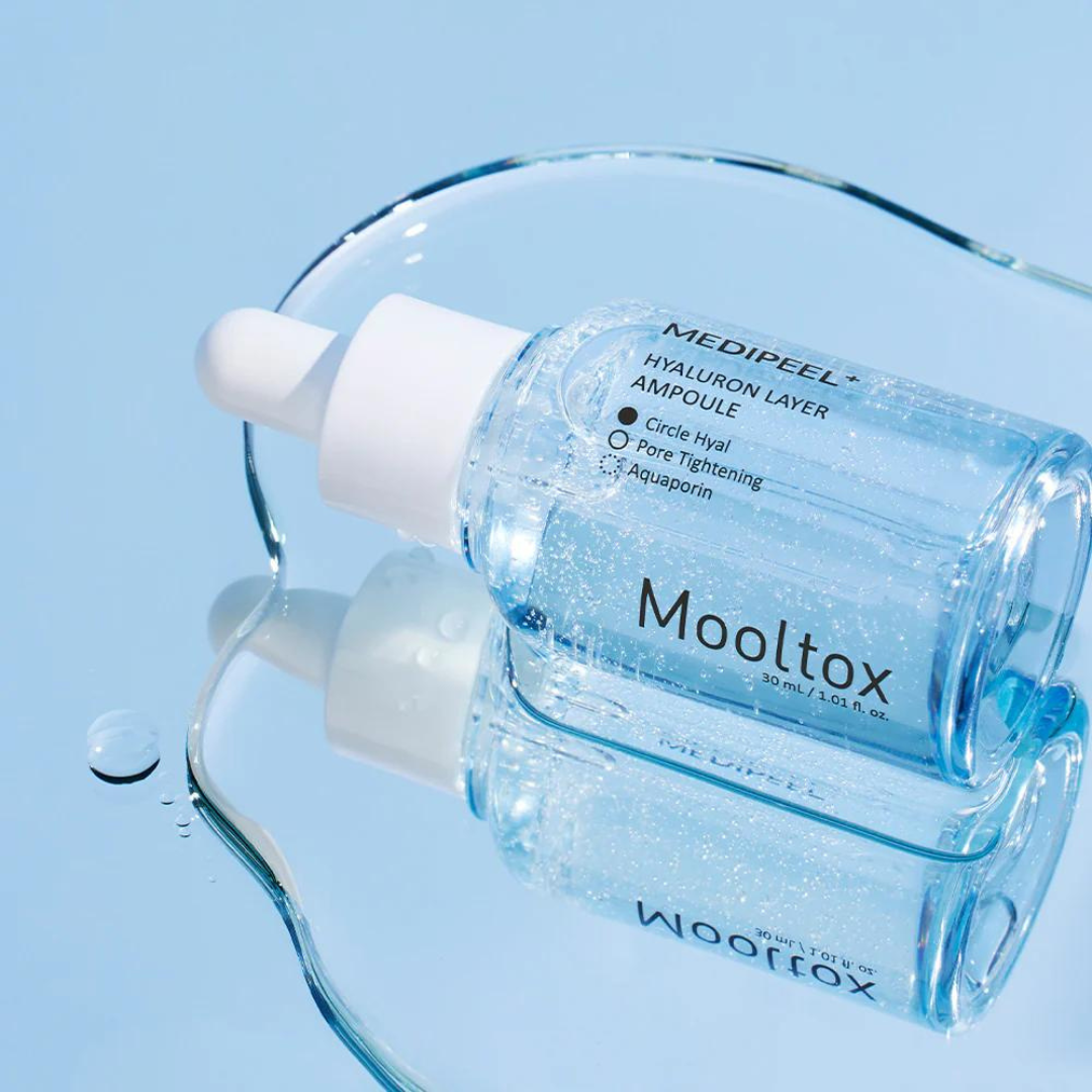 Medipeel Hyaluronic Acid Layer Mooltox Ampoule 30ml, clear glass bottle with dropper, showing the ampoule product for skin hydration.