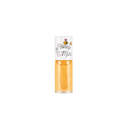 A'pieu Honey & Milk Lip Oil in a clear tube, showing golden-colored lip balm and essence for nourishing, glossy lips.