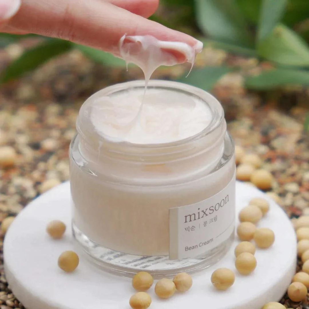 Cream jar labeled "Bean Cream 50ml" from Mixsoon, a face moisturizer with a smooth, creamy texture visible in the image.