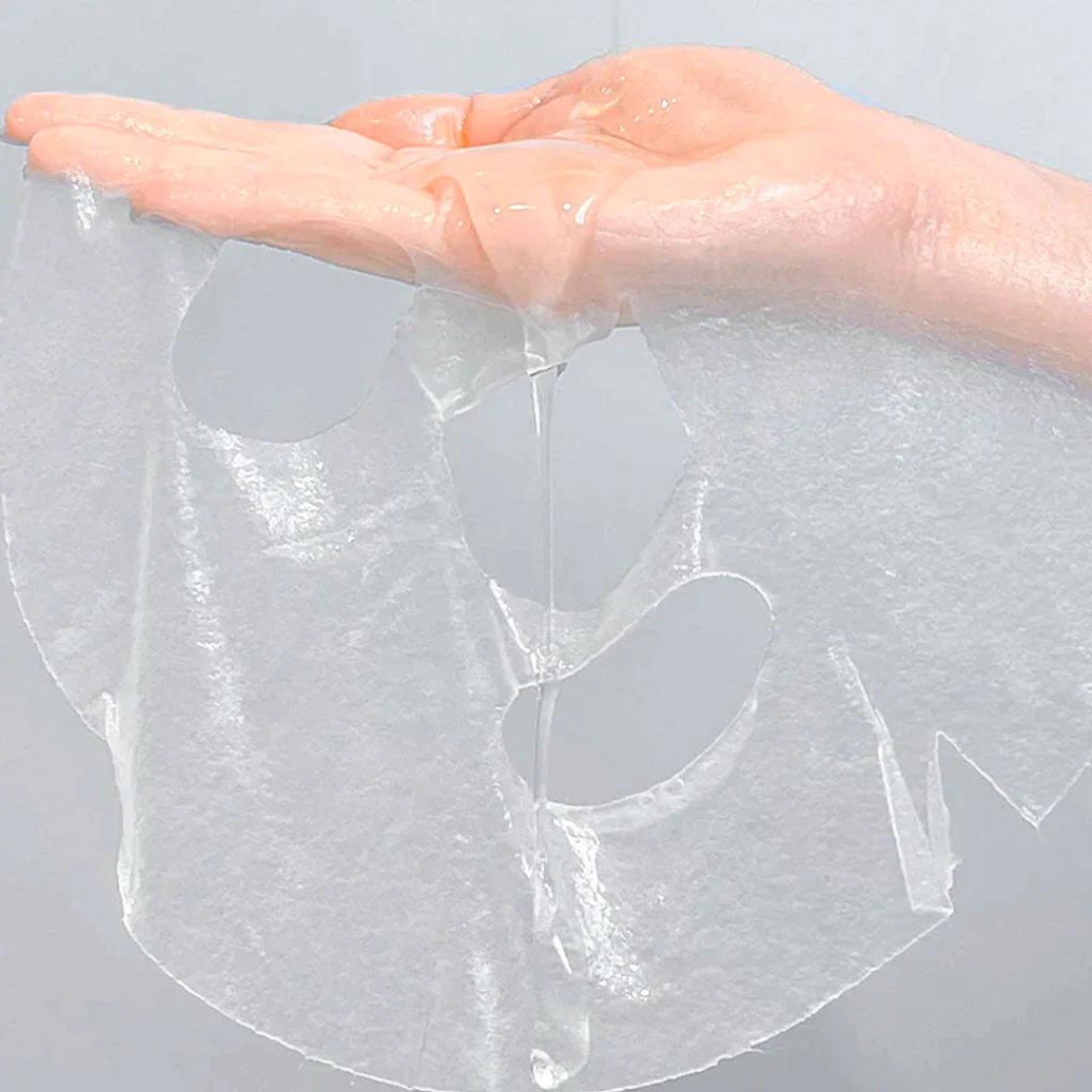 Anua Heartleaf Cream Sheet Mask Night Solution sleeping mask relaxing on a surface, showcasing its creamy texture and packaging.