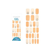 Glossy Blossom Dewdrop gel nail strips applied on nails, showcasing a glossy, translucent blue design for a stylish manicure.