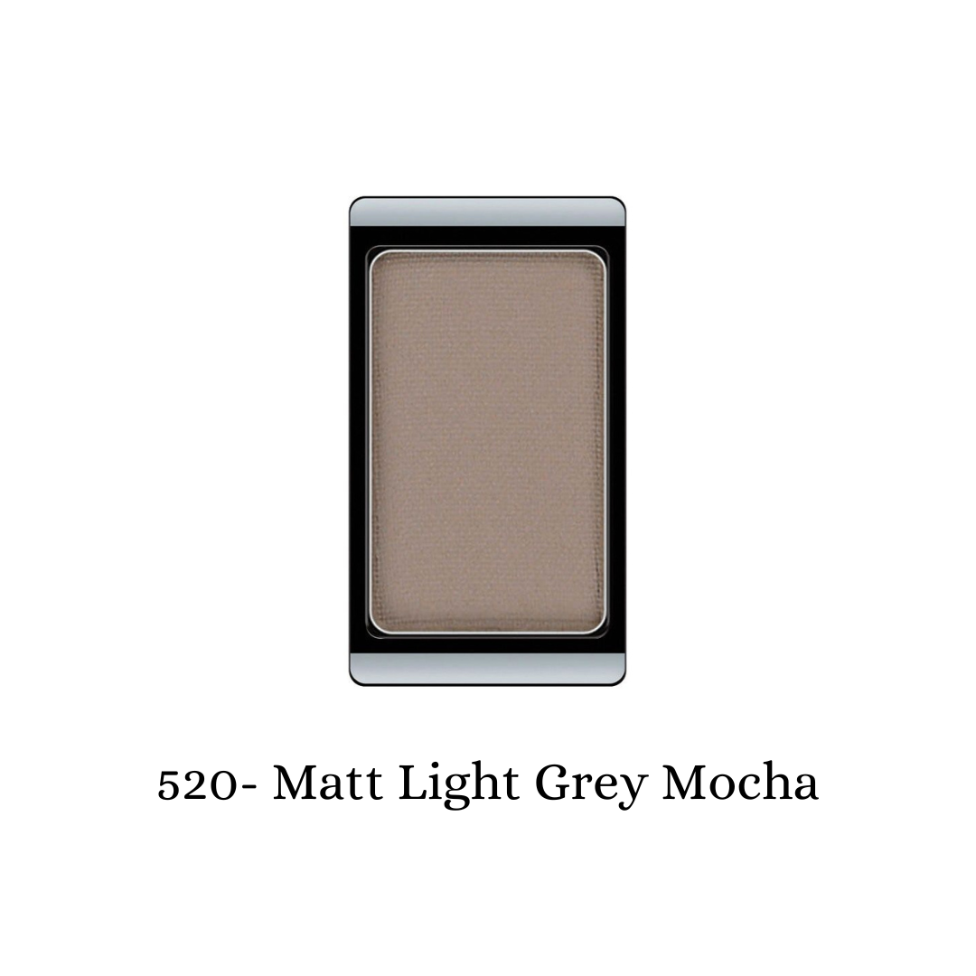 Light grey matte eyeshadow by ARTDECO, showcasing smooth, velvety texture in a close-up image.