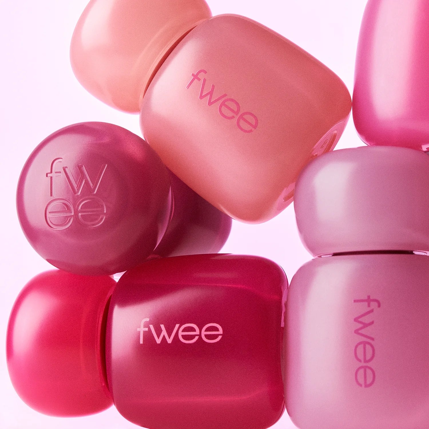 Fwee Pink Obsession Stay-Fit Lip Tint with seven shades, featuring a close-up of the vibrant lip tint tubes.