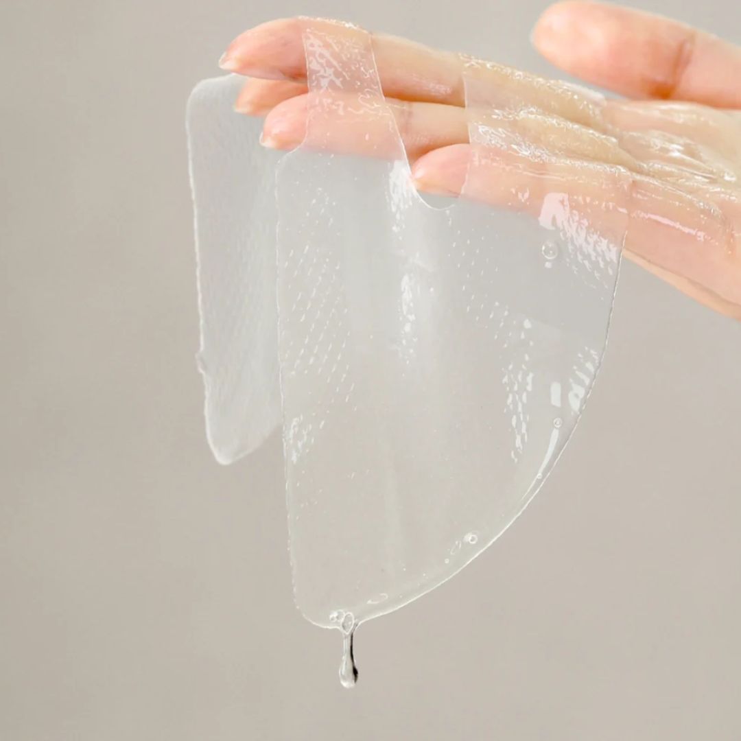 Ma:nyo Galactomy Essence Wrap Mask sheet lying flat, showing the packaging and mask material for hydrating skincare.