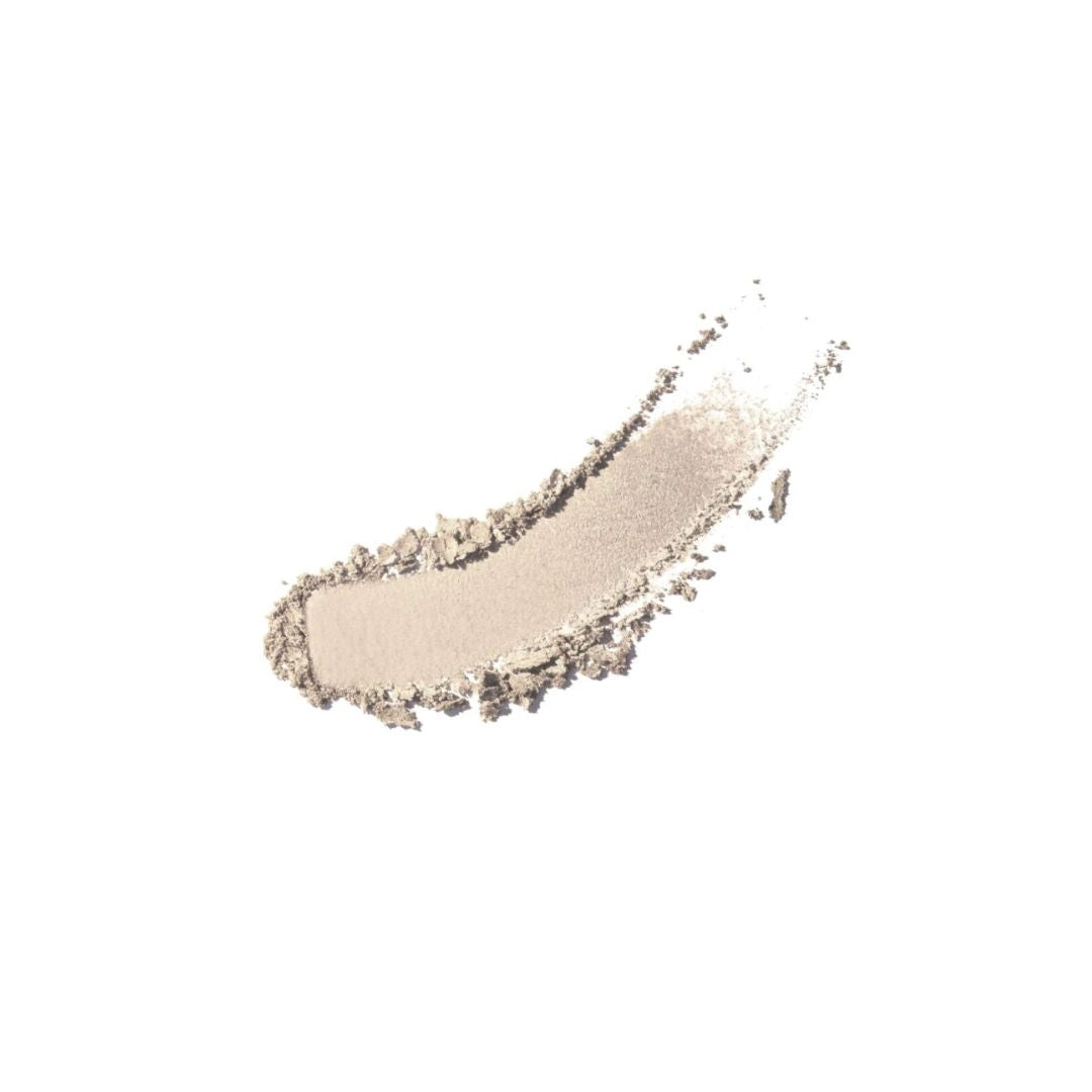 ARTDECO glow highlighting powder, a highlighter with luminous shimmer, displayed in an open compact showing its radiant finish.