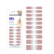 Glossy Blossom gel nail strips with gold and pink gradient glitter design on neatly manicured nails.