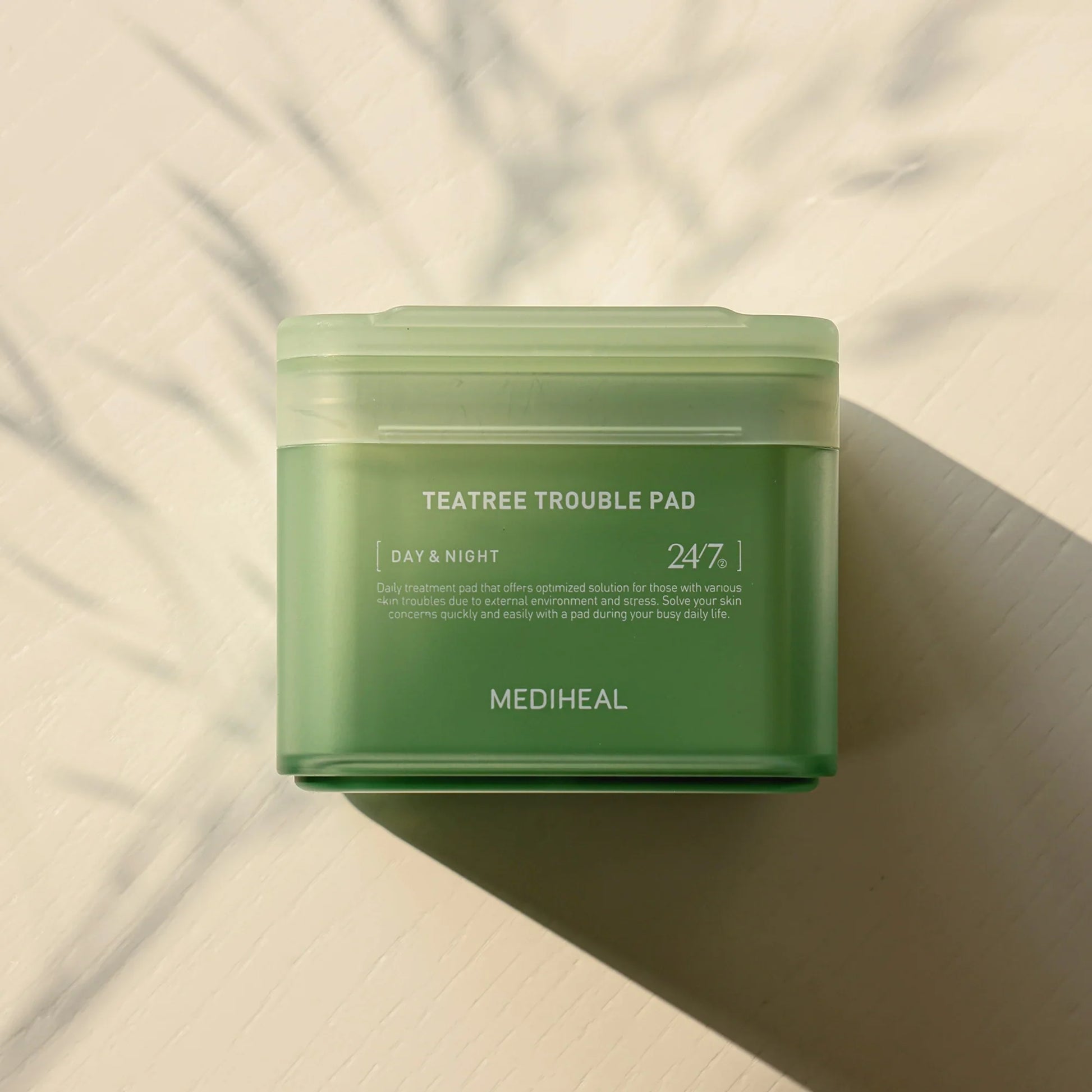 Mediheal Tea Tree Trouble Pad toner pads in a green package, 100 pieces, designed for skin clearing and blemish control.