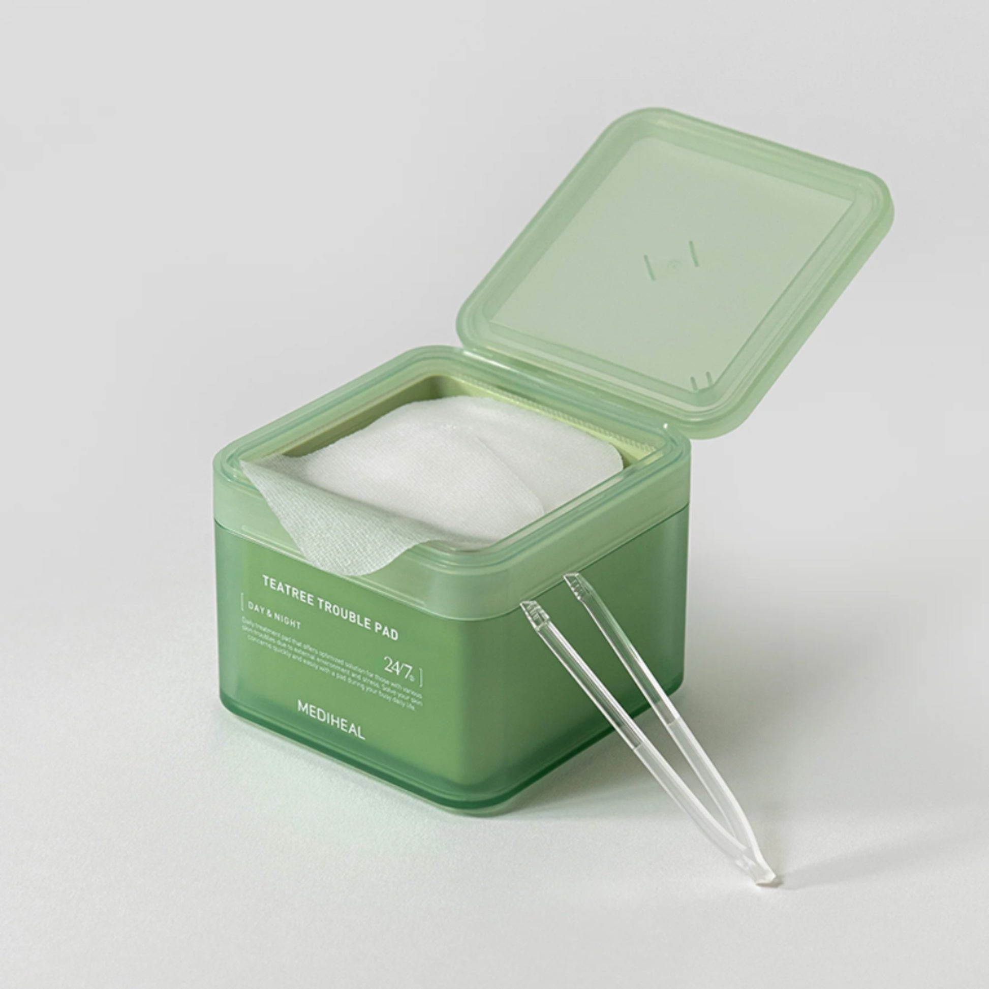 Mediheal Tea Tree Trouble Pad toner pads in a green box, 100 pieces, designed for acne-prone skin treatment.