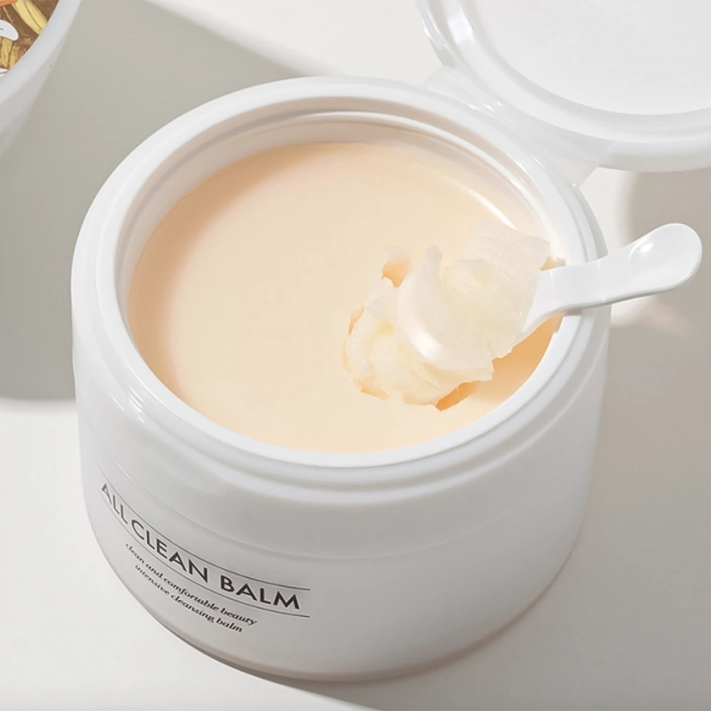 Heimish All Clean Balm Mandarin 120ml jar with orange lid, showing the oil and balm cleanser in a skincare setting.