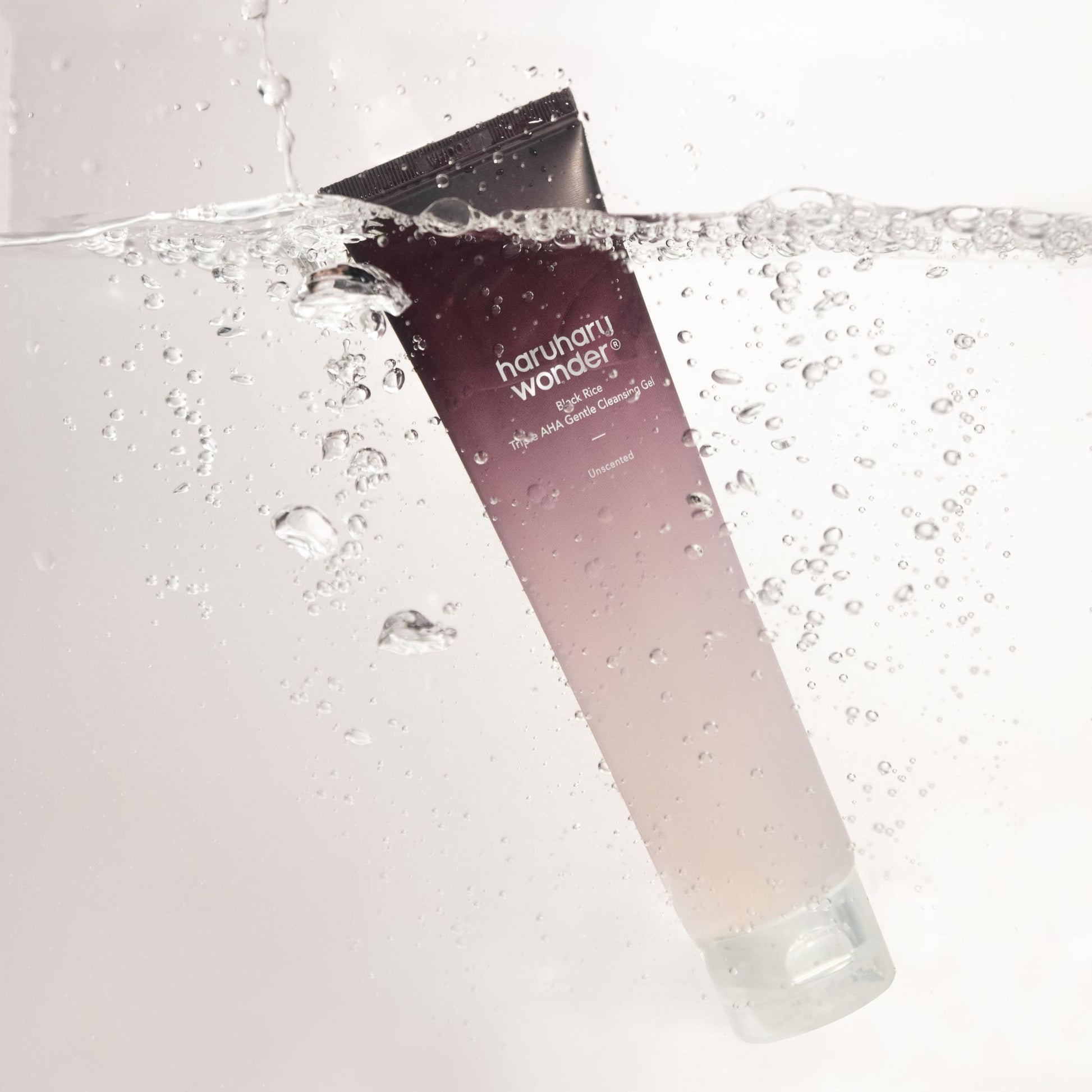 Haruharu Wonder Black Rice Triple AHA Gentle Cleansing Gel in 100ml, showcasing the gel and foam cleanser with black rice ingredients.
