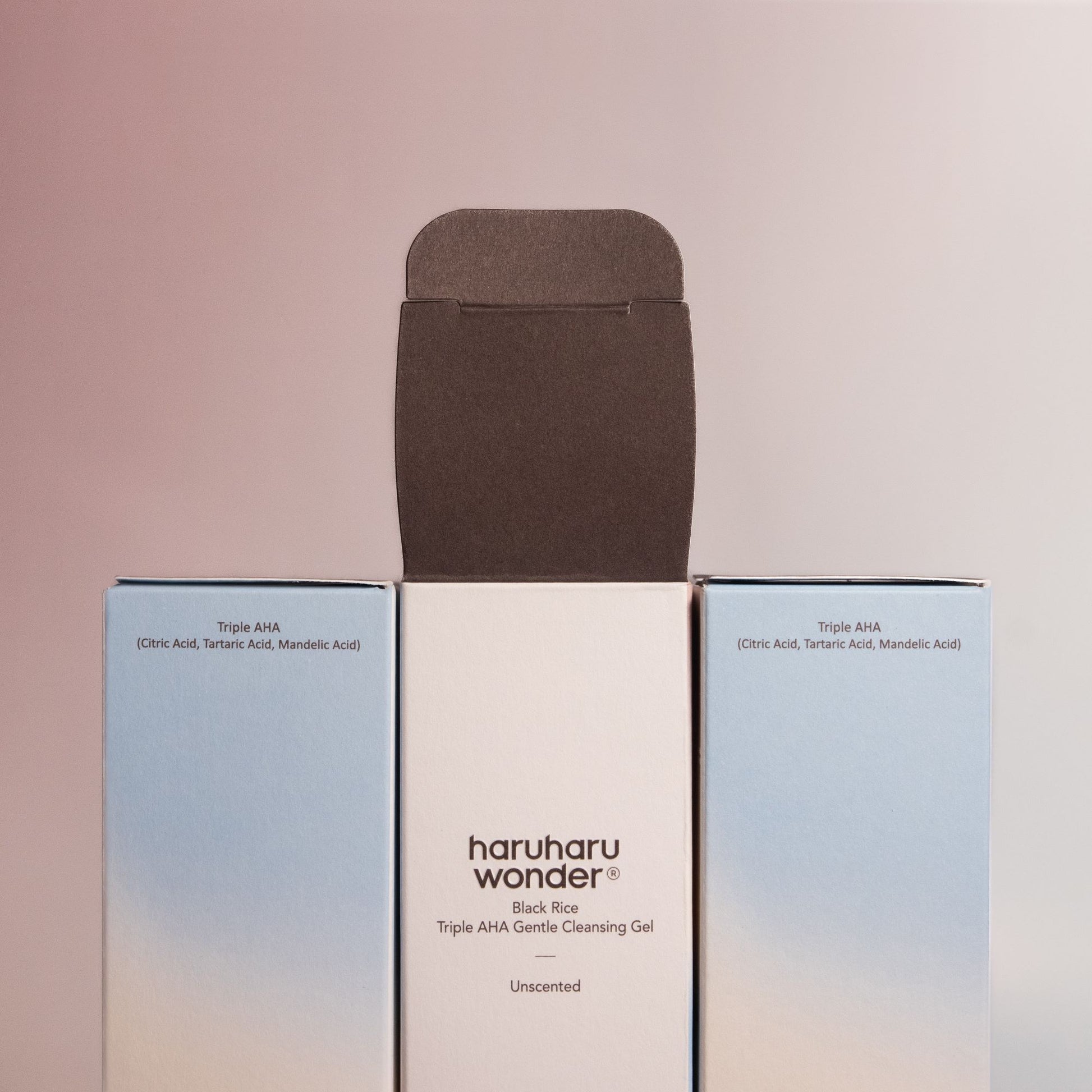 Haruharu Wonder Black Rice Triple AHA Gentle Cleansing Gel 100ml in clear squeeze bottle with foam texture