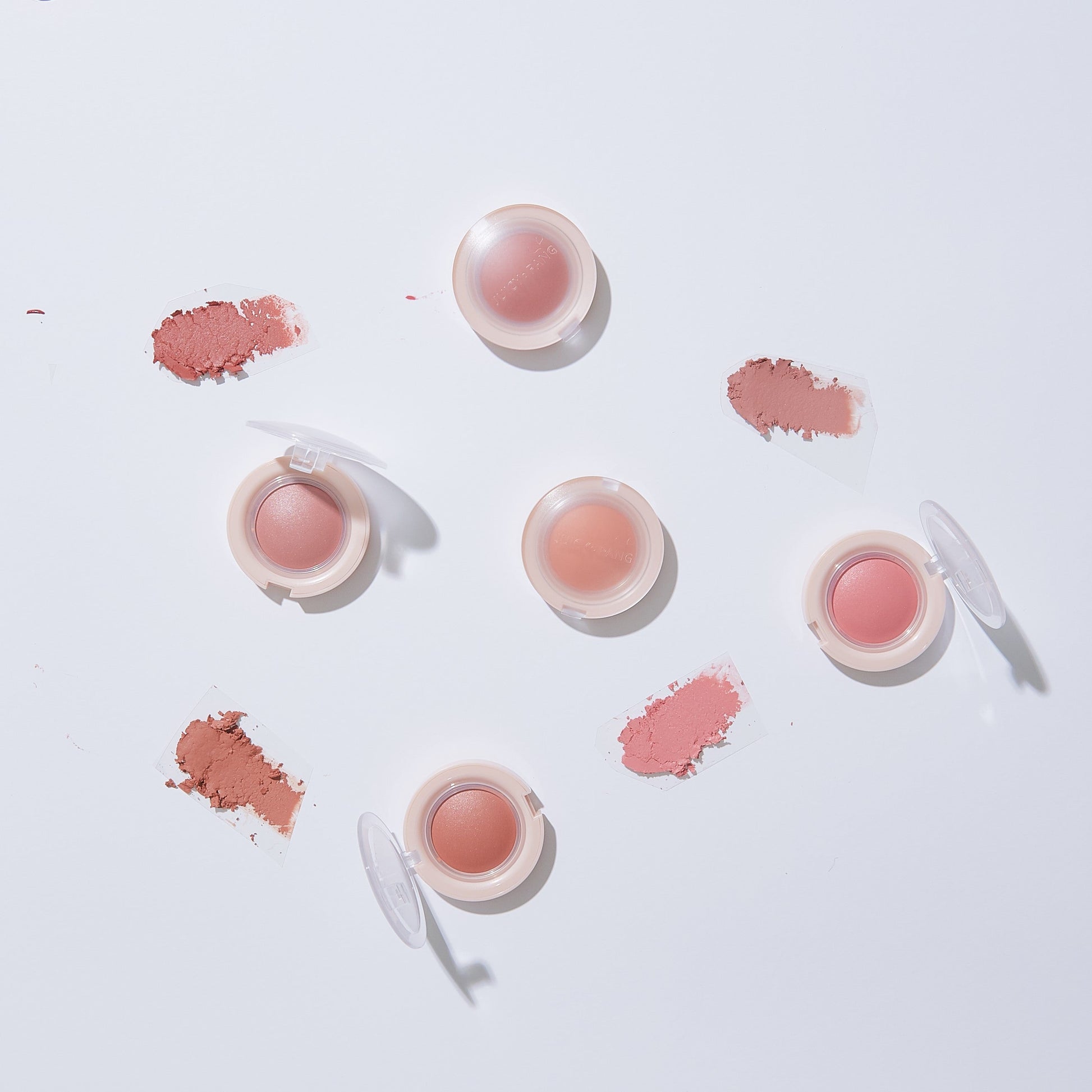 A'pieu Juicy-Pang Jelly Blusher in a soft pink shade, showing the compact blush with the lid open and the product inside.