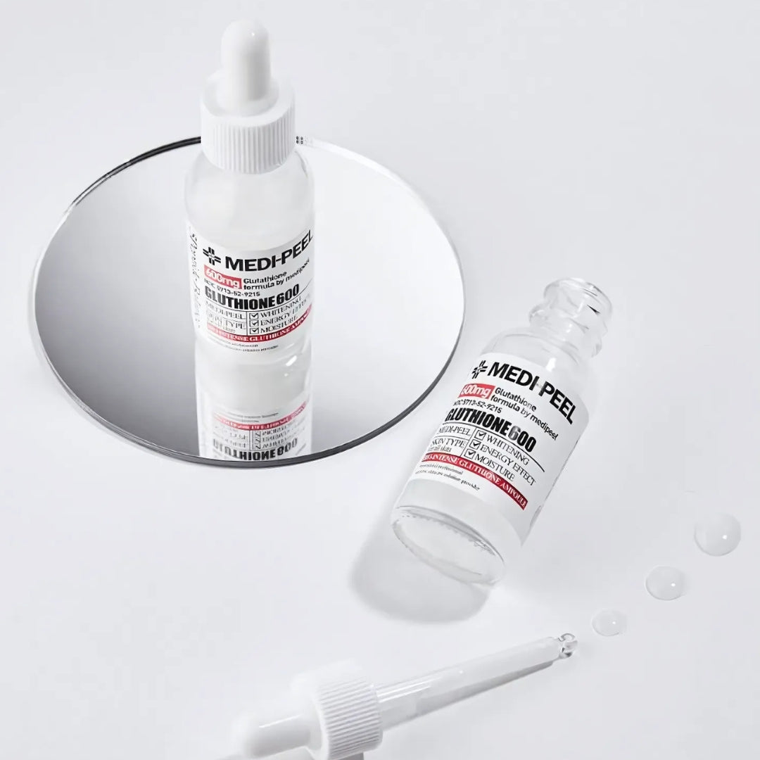 MEDI-PEEL Bio Intense Glutathione White Ampoule 30ml, clear glass ampoule with white liquid, skincare product for brightening.