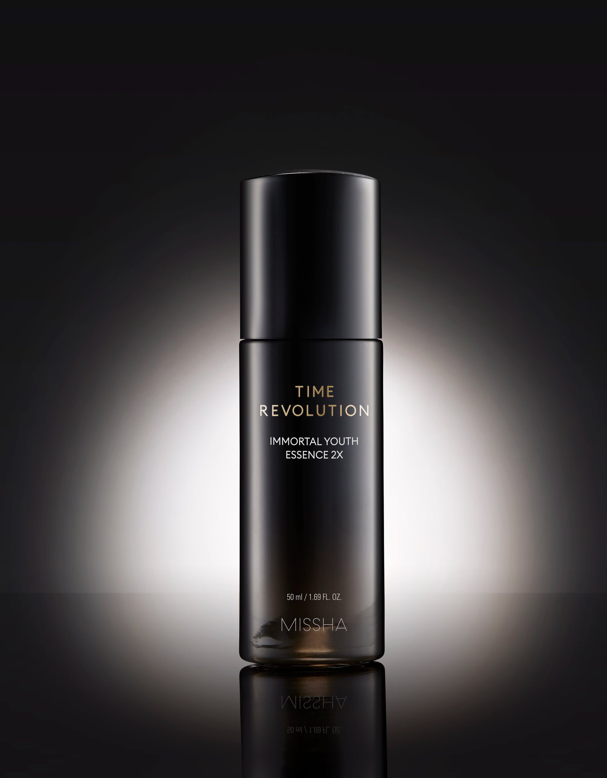 Missha Time Revolution Immortal Youth Essence 2X 50ml bottle, clear glass container with a pump dispenser and label.