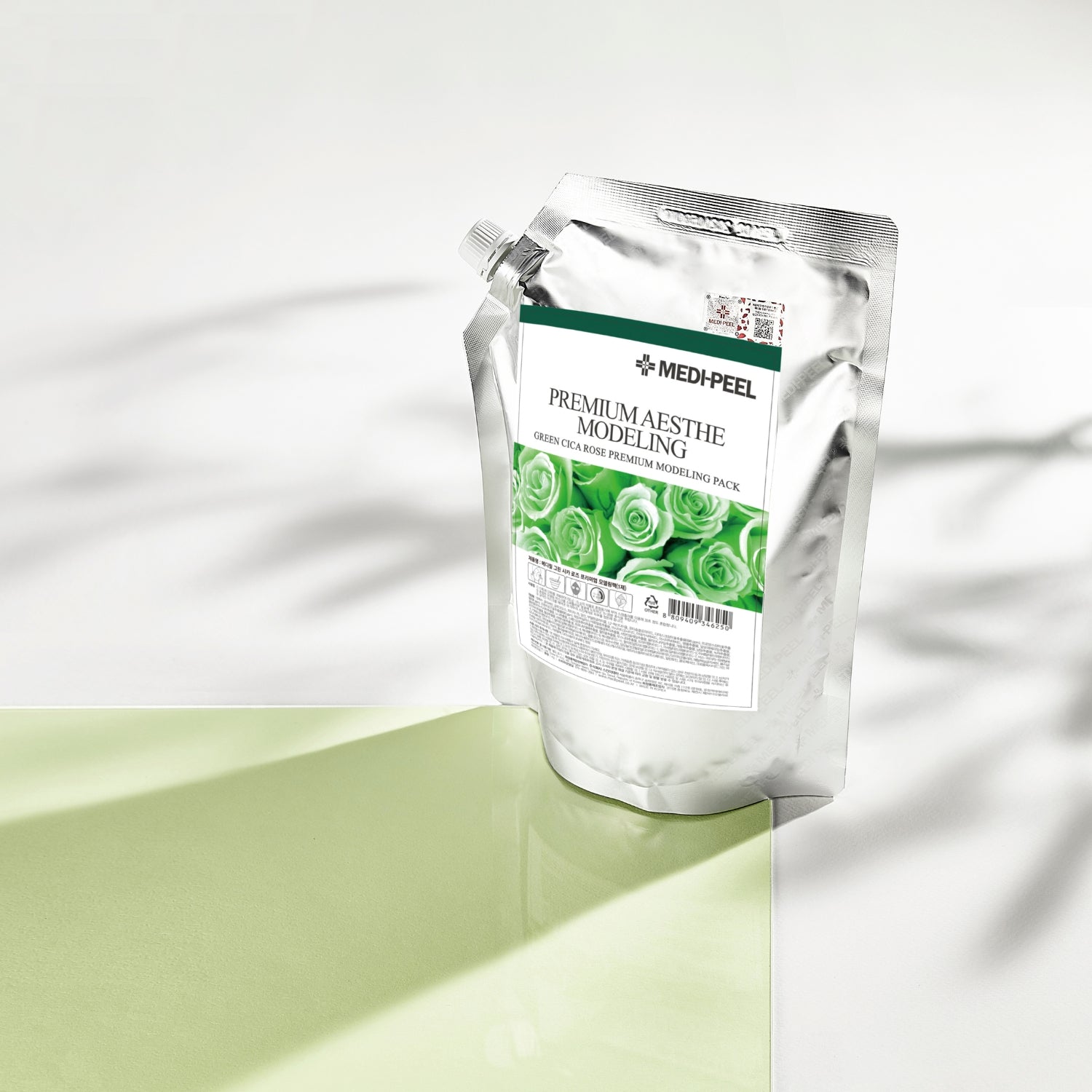Green Cica Rose Premium Modeling Mask Set by MEDIPEEL+ in a 1kg container, showing the lush green and rose-colored product.