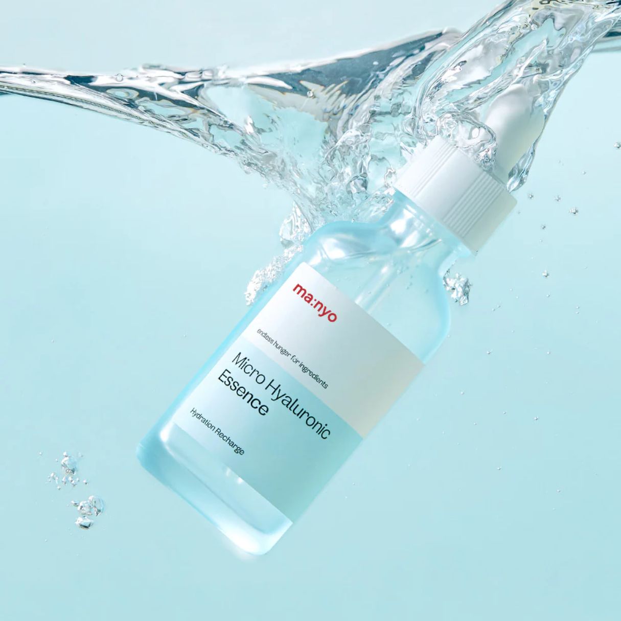 Ma:nyo Micro Hyaluronic Essence 50ml bottle showing clear, lightweight essence in a sleek bottle with a dropper cap.