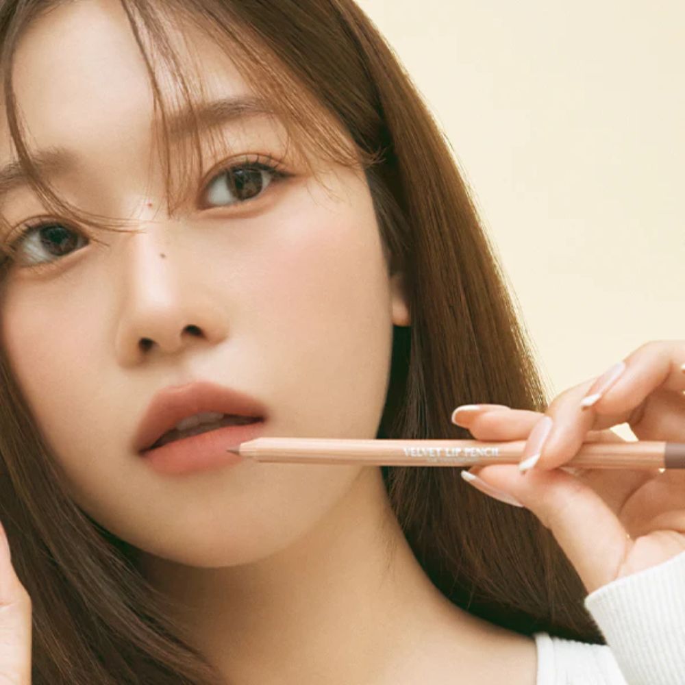 Clio Velvet Lip Pencil Set with multiple lip liner shades, shown on a model's lips for precise application and smooth finish.