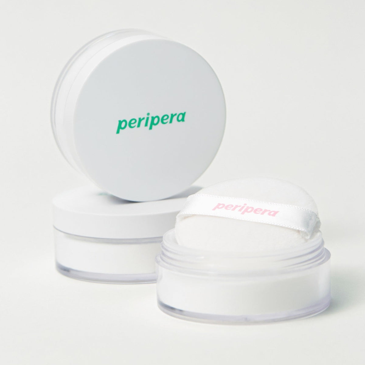 Peripera Oil Capture Priming Powder in a compact setting powder container for oil control and matte finish.