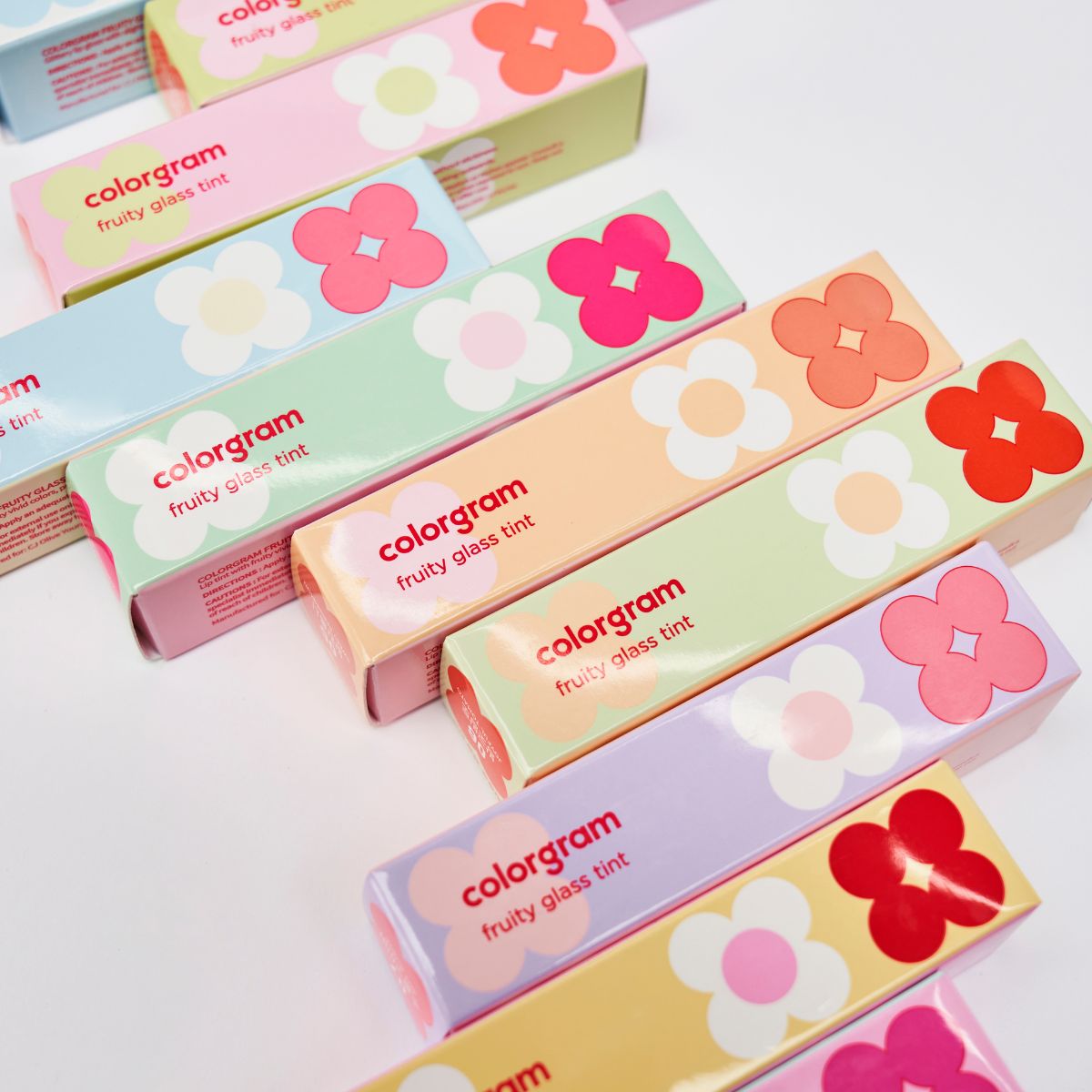 Colorgram Fruity Glass Lip Tint in colorful packaging, showcasing vibrant lip tint product with fruity-inspired design.