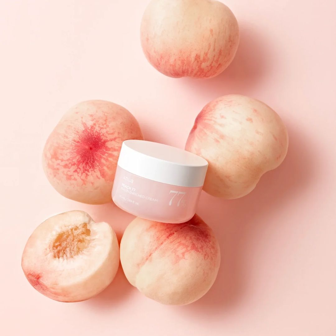 Anua Peach 77 Niacin Enriched Face Moisturiser in a 50ml jar, featuring a peach-colored container and a smooth cream texture.