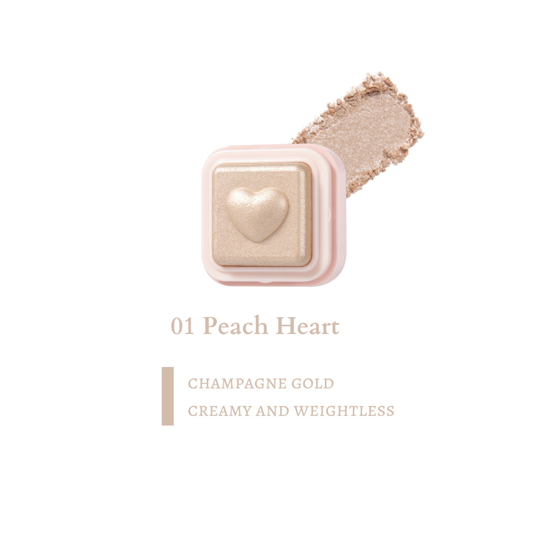 Colorgram Milk Bling Heart highlighter in peach color, featuring a heart-shaped design and vibrant ink for creative highlighting.