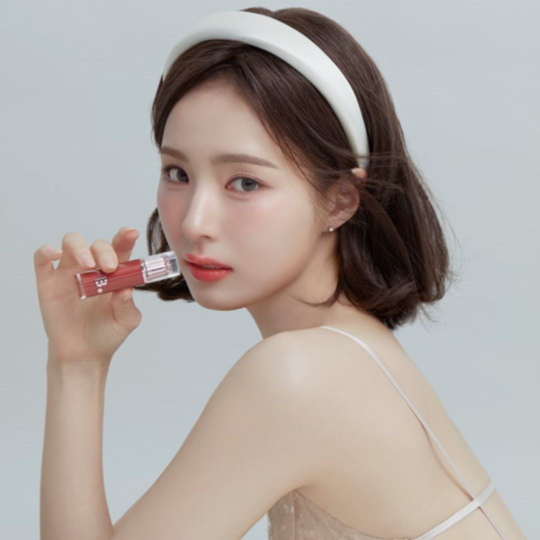 Banila Co Dew Glow Lip Tint in RD01, vibrant liquid lip color with a glossy finish, applied on lips for a natural glow.