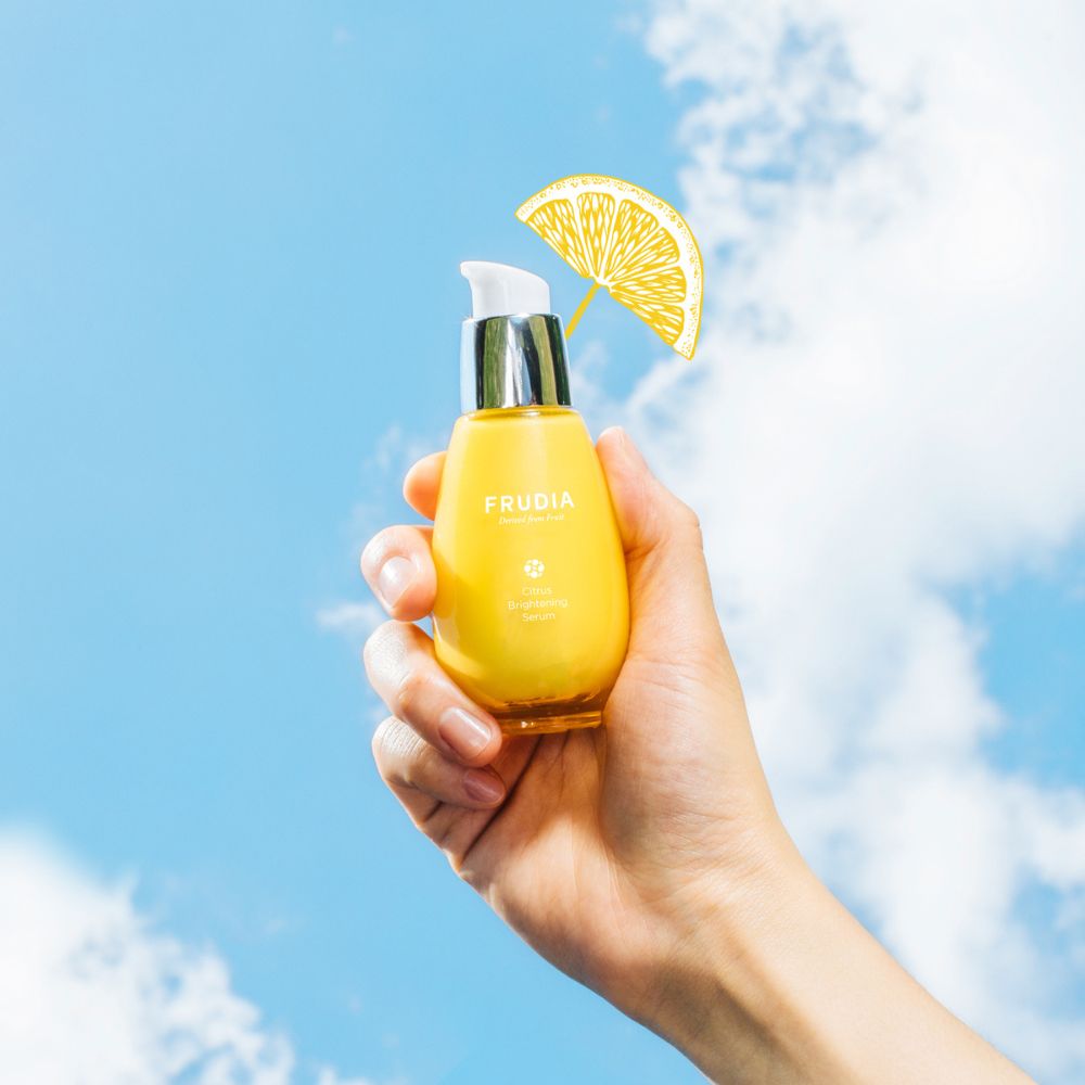 Frudia Citrus Brightening Serum in a 50g bottle, showcasing the clear serum with citrus fruit imagery on the packaging.