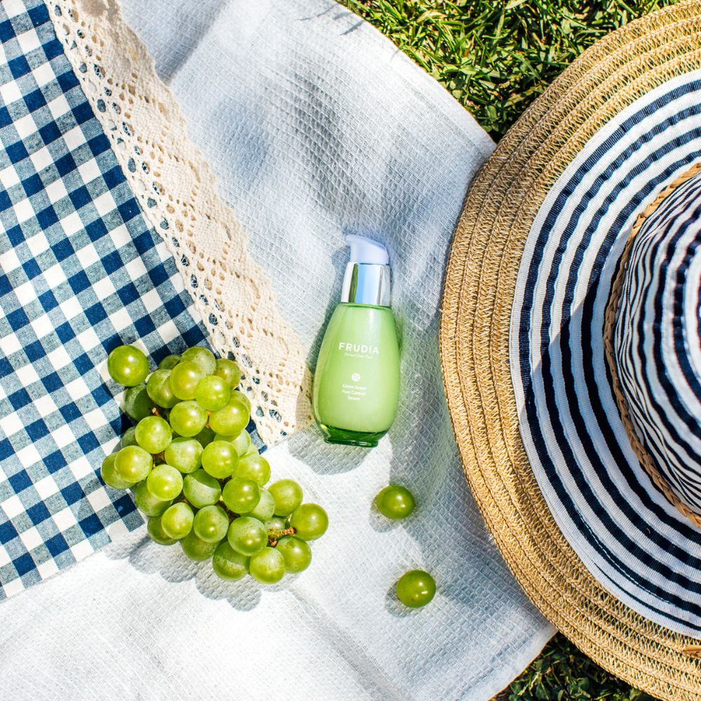 Frudia Green Grape Pore Control Serum 50g bottle with pump, featuring a green label and clear serum inside.