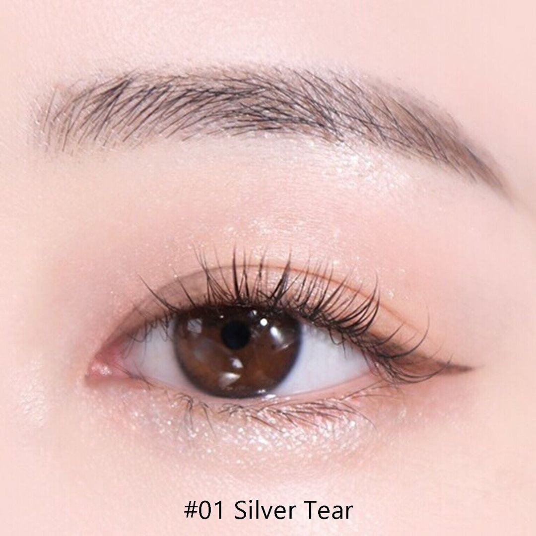 Silver liquid eyeliner with glitter from Colorgram's Milk Bling Glitter Liner collection, featuring a sleek silver eye model.
