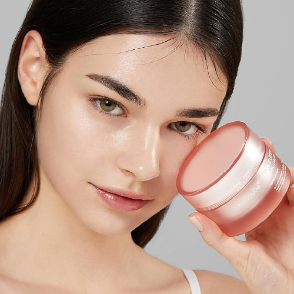 Medicube Triple Collagen Cream 4.0 face moisturizer in a 50ml jar showing smooth, creamy texture on a white background.