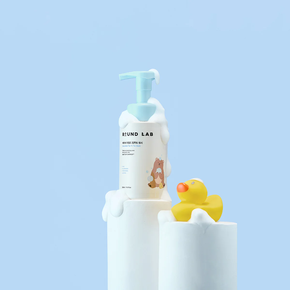 Round Lab Baby Mild Top To Toe Wash 300ml, gentle body wash and scrub for infants, in a white and blue bottle.
