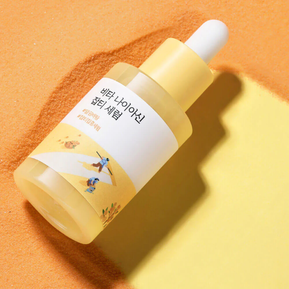 Round Lab Vita Niacinamide Dark Spot Serum 30ml in a sleek bottle, showing the serum's clear, lightweight texture and applicator.