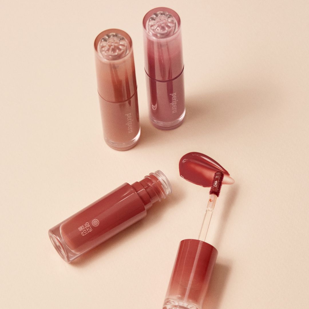 Peripera Ink Mood Glowy Tint Honey K-ookie lip tint with a glossy, textured finish in a warm honey shade.