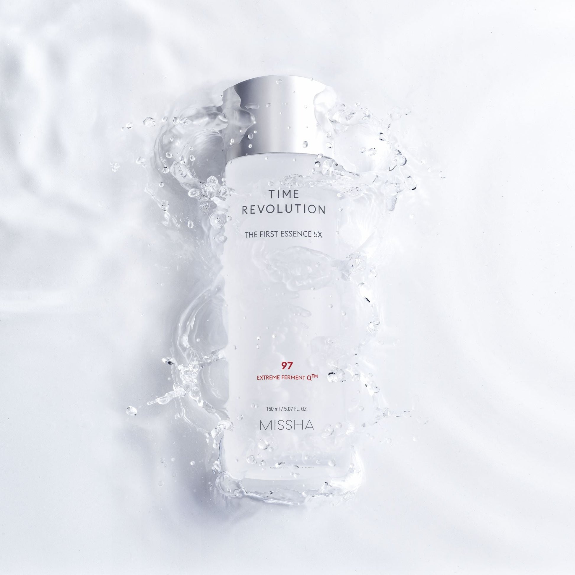Missha Time Revolution The First Essence 5X in a 150ml bottle, clear liquid with a pump dispenser, placed on a neutral background.