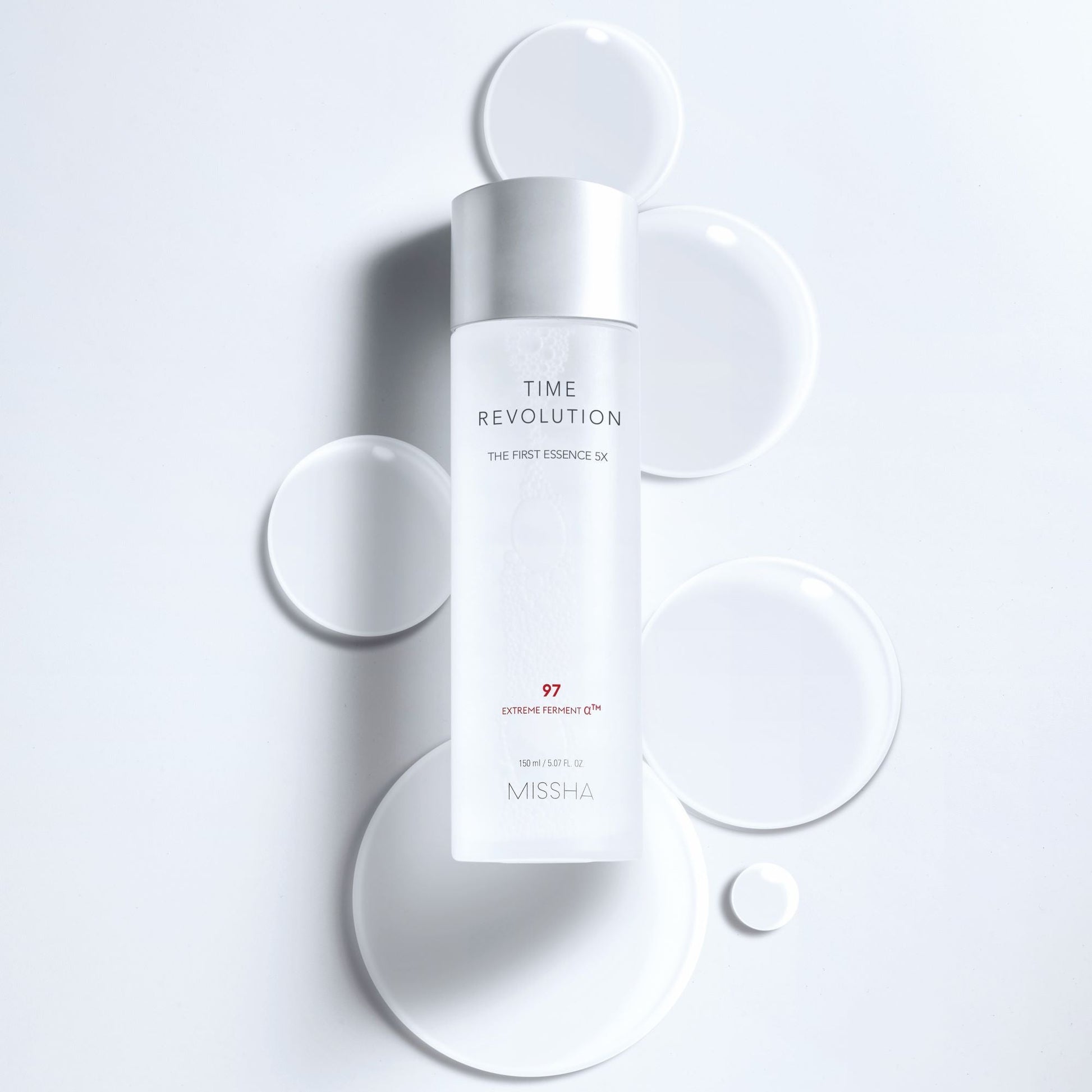 Missha Time Revolution The First Essence 5X in a 150ml bottle, featuring a clear liquid and sleek packaging.