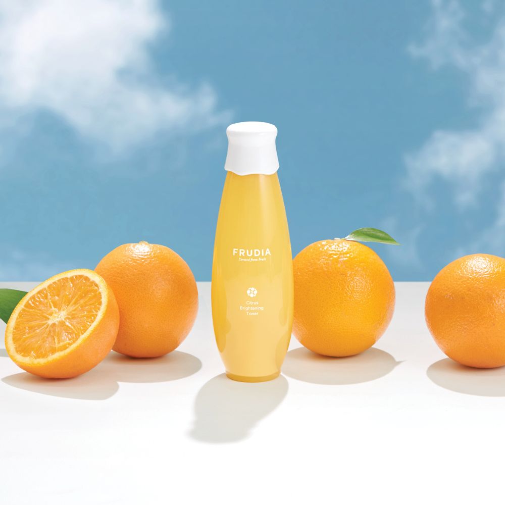 Frudia Citrus Brightening Toner 195ml bottle with citrus-themed label and clear liquid inside.