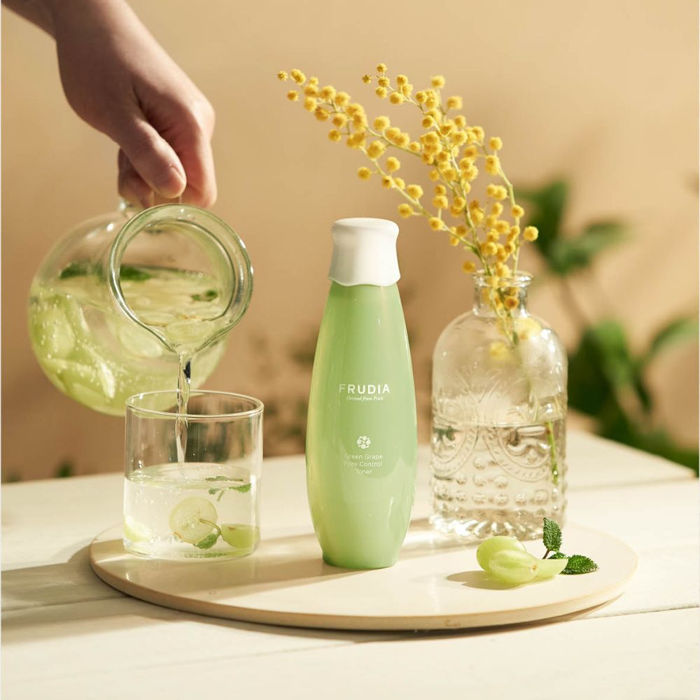 Frudia Green Grape Pore Control Toner in a 195ml bottle, featuring a clear liquid with green grape extract visible inside.