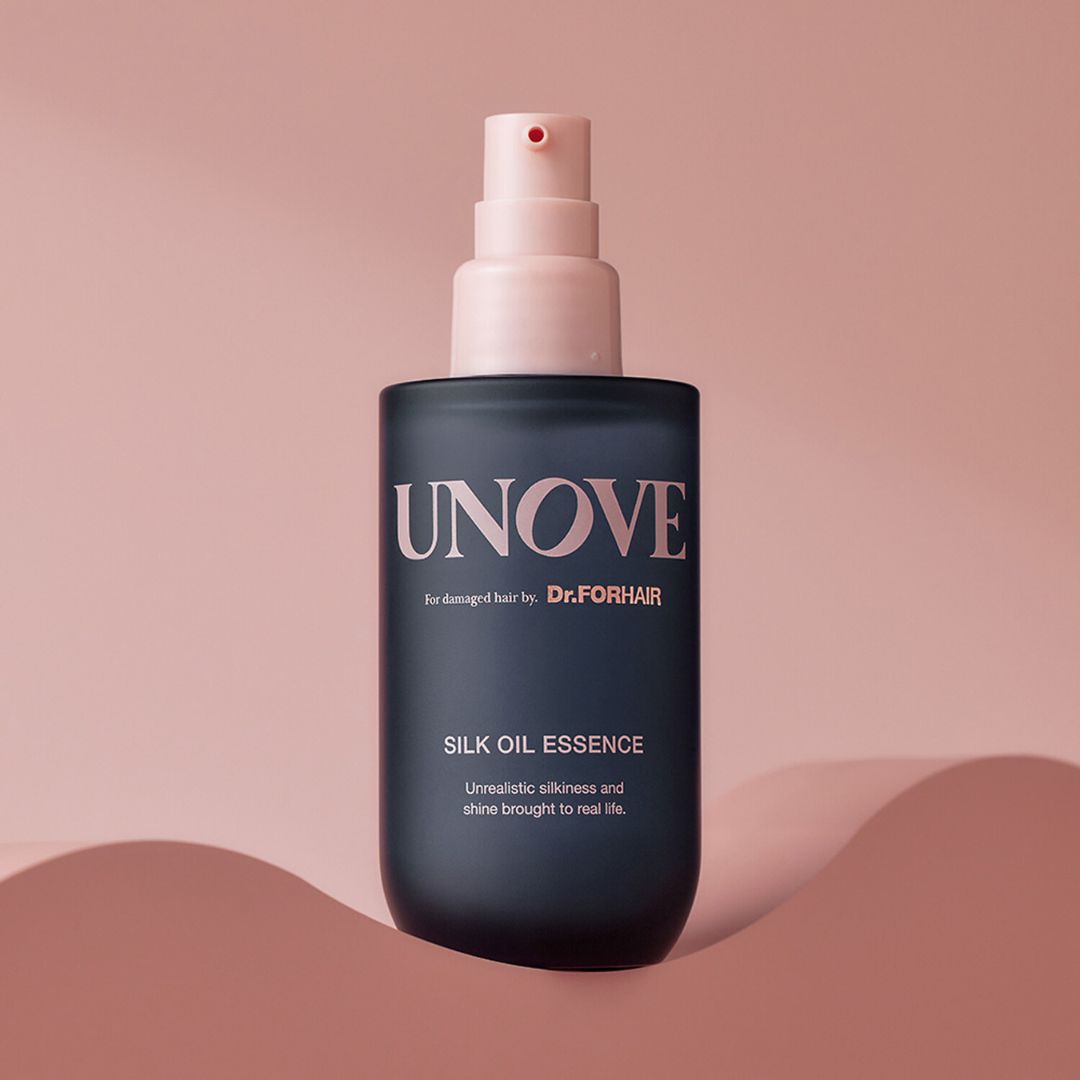 UNOVE Silk Oil Essence 70ml conditioner and treatment bottle with a sleek design and clear labeling for nourishing hair care.