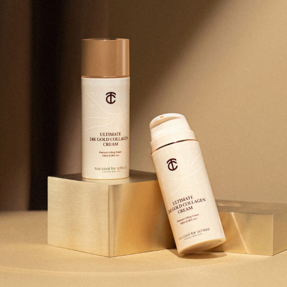 Too Cool For School Ultimate 24K Gold Collagen Cream 100ml face moisturizer jar with gold accents and sleek packaging.