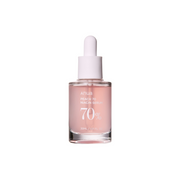 Anua Peach 70 Niacinamide Serum 30ml bottle with a clear glass container and peach-colored label, shown on a white background.